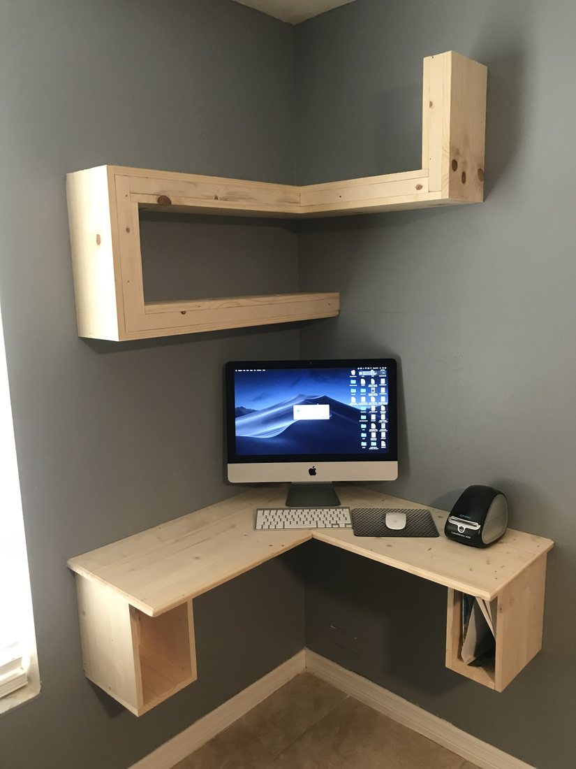 Floating corner desk and shelving set into the wall