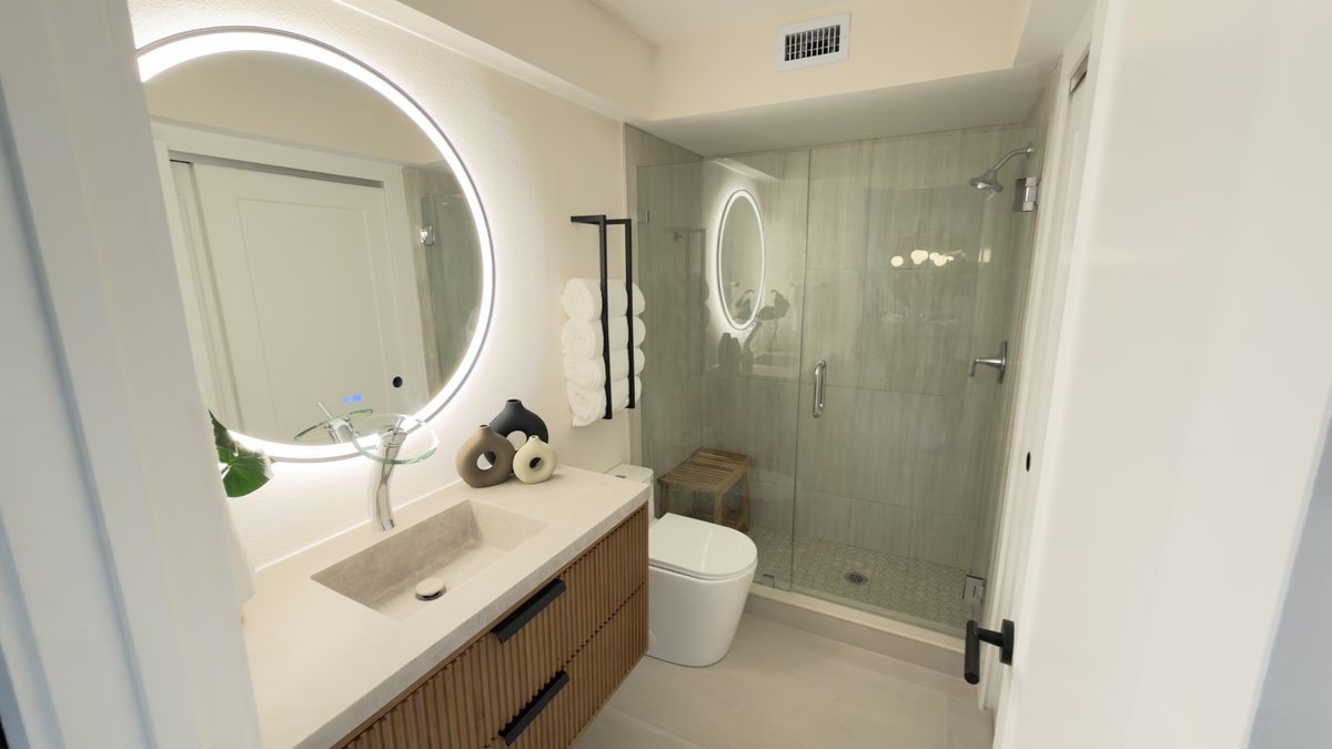 Bathroom remodel with frameless glass shower and floating vanity