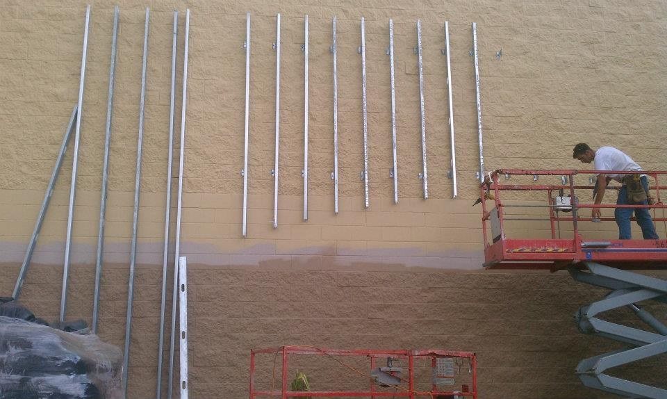 Column elements going up along the exterior wall during construction