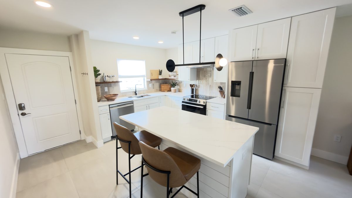 Condo kitchen remodel with quartz island seating